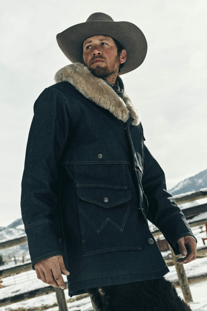A model wears the Wrangler Filson collaboration Packer Jacket.