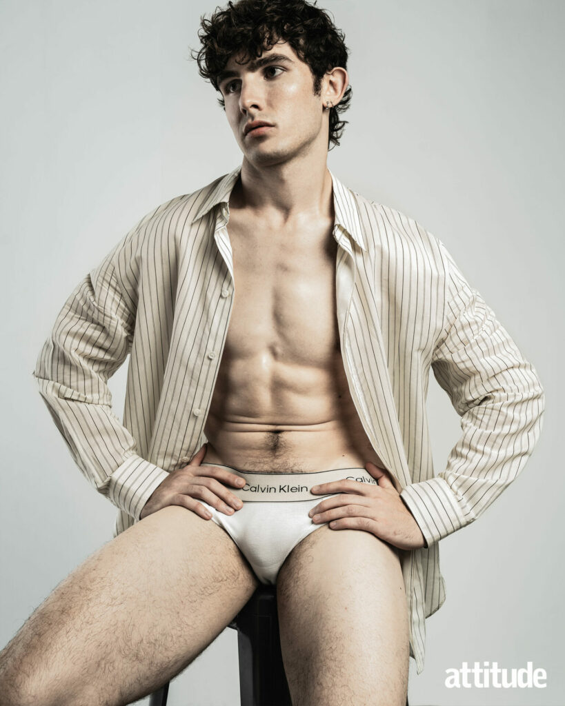 Model Edgar wears an unbuttoned shirt from COS and underwear from Calvin Klein.