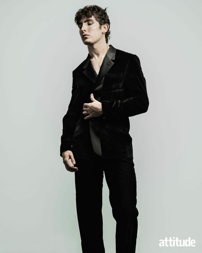 Model Edgar wearing a velvet and satin trimmed suit from Fendi.