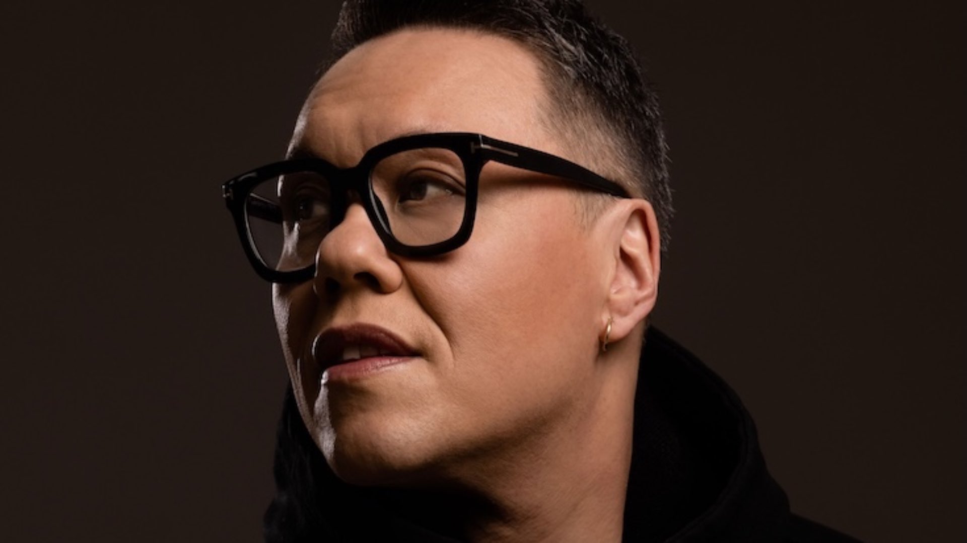 Gok Wan head shot wearing glasses looking to the left