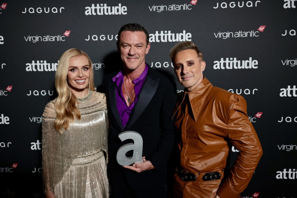 Katherine Jenkins, Luke Evans holding 'A' award and Ian 'H' Watkins in a brown leather suit
