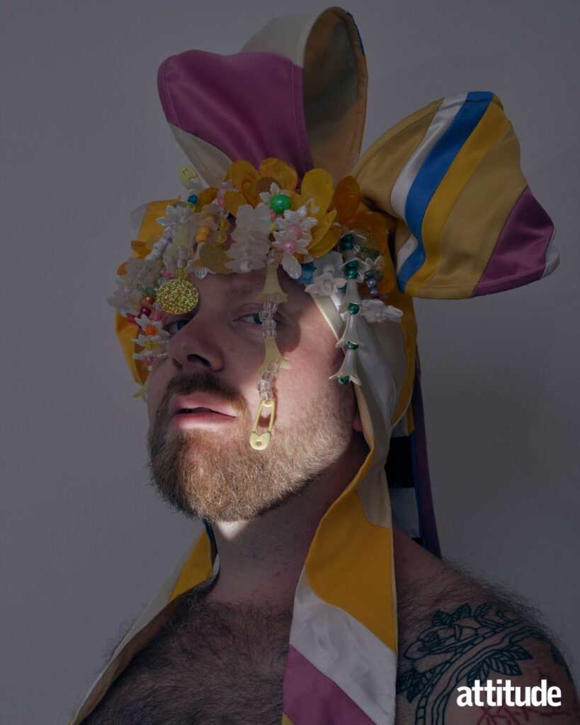 Ginny Lemon wearing a colour head dress