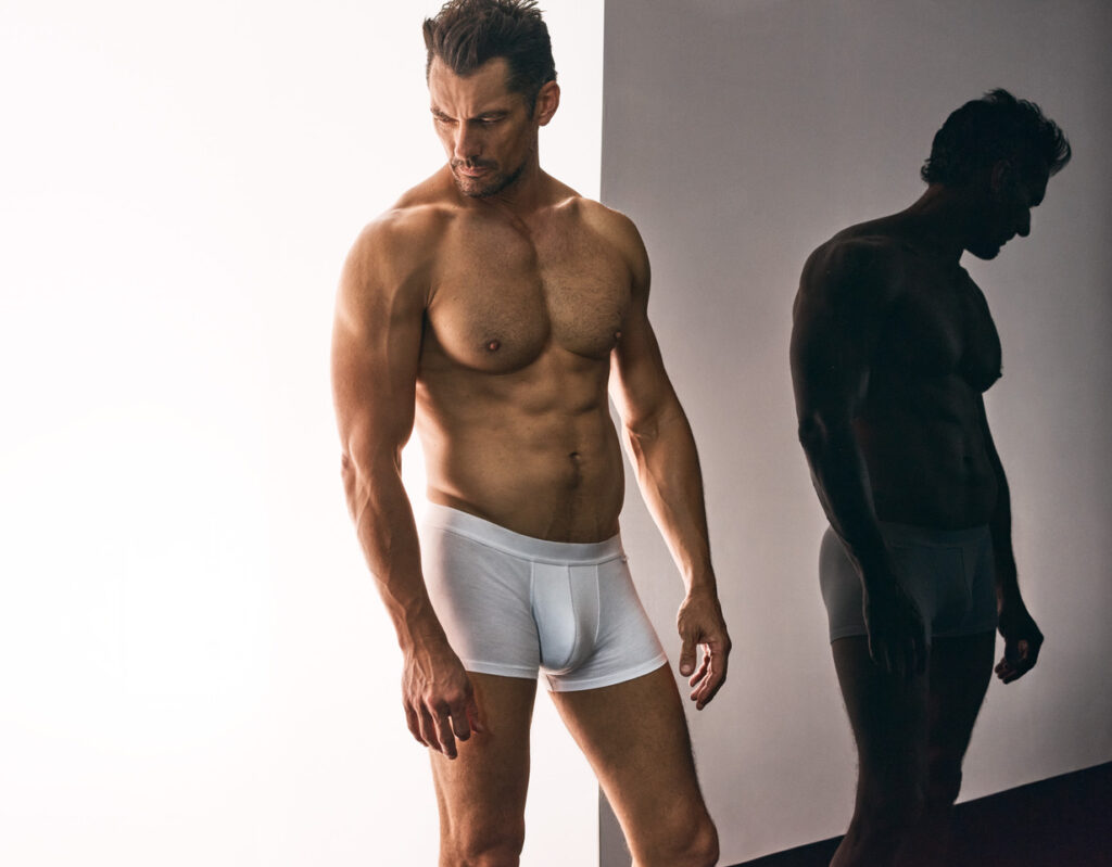 Model David Gandy wears the David Gandy Wellwear ultimate trunk men's underwear in white.