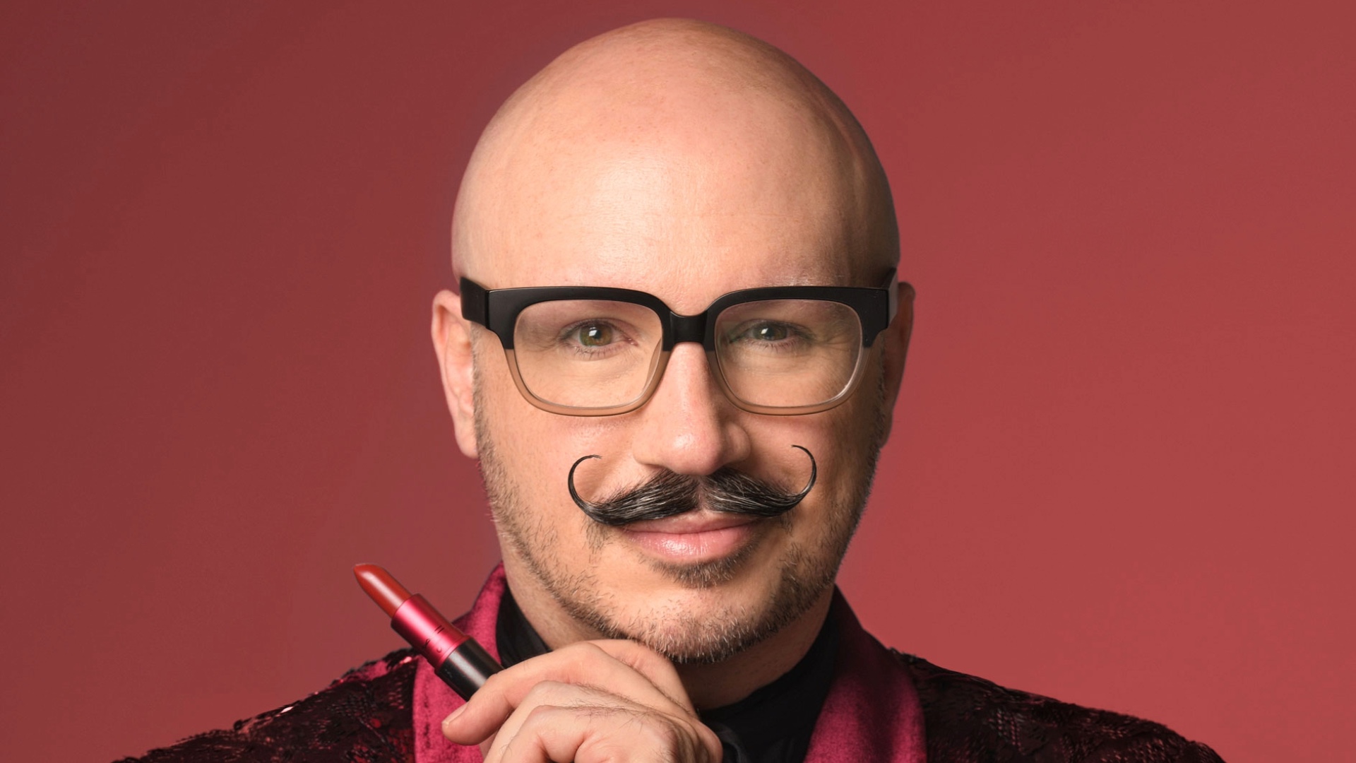 Profile shot of Dominic Skinner wearing black glasses