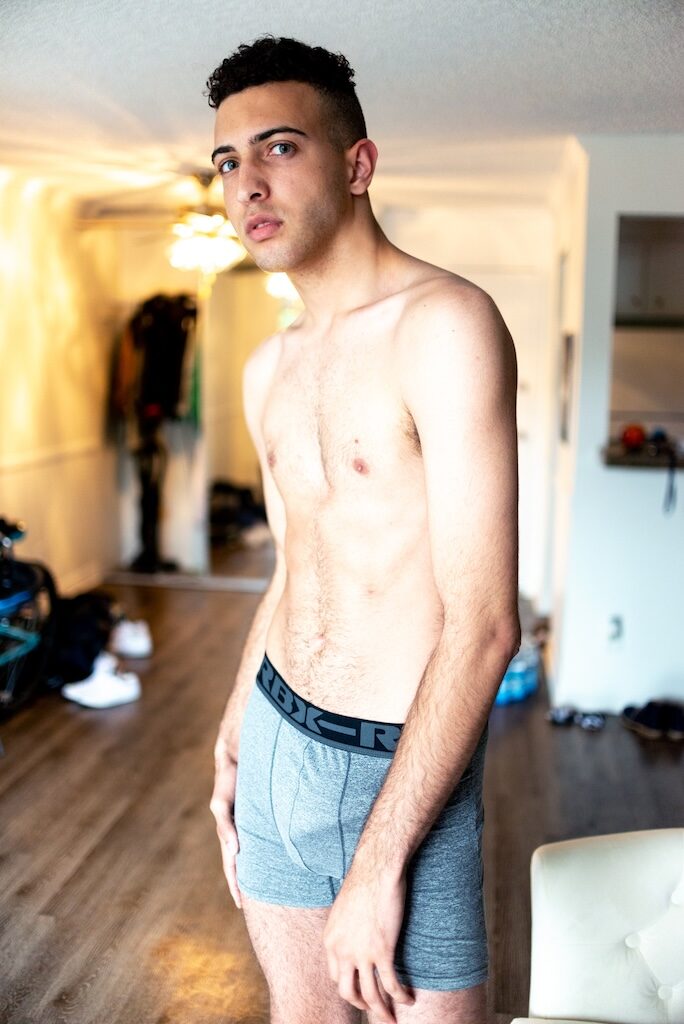 Model Trentton Barber in grey boxer shorts, standing in a rom with a wooden floor(Image: Elska/Liam Campbell)