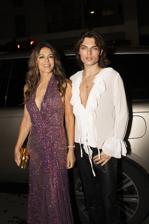 Liz and Damian Hurley, Liz in a purple sequinned dress and Damien in a white shit and black trousers (Image: Attitude: Aaron Parsons)