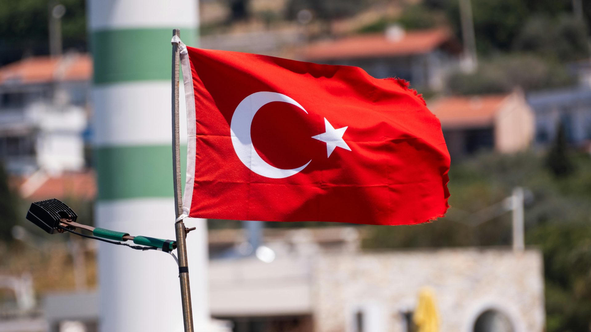 Turkish flag in the wind with a speaker attached to it