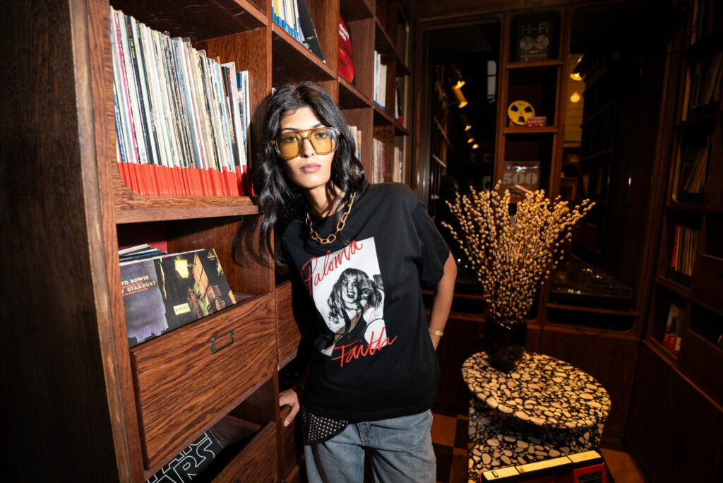 A lifestyle shot of the Virgin and Choose Love "Remasted" collection charity T-shirts featuring Paloma Faith.