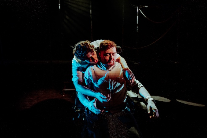 Transpose: SUBVERSE performers one in a wheelchair, the other with their arms around them