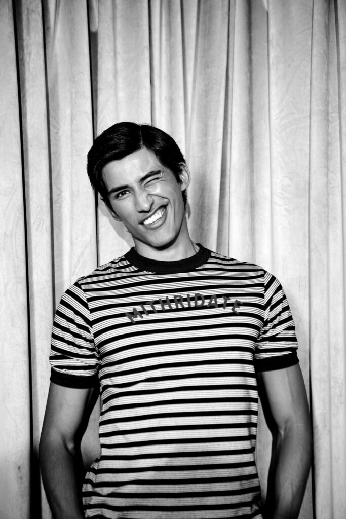 A model wear a striped T-shirt from the Mithridate Karaoke Club capsule collection.