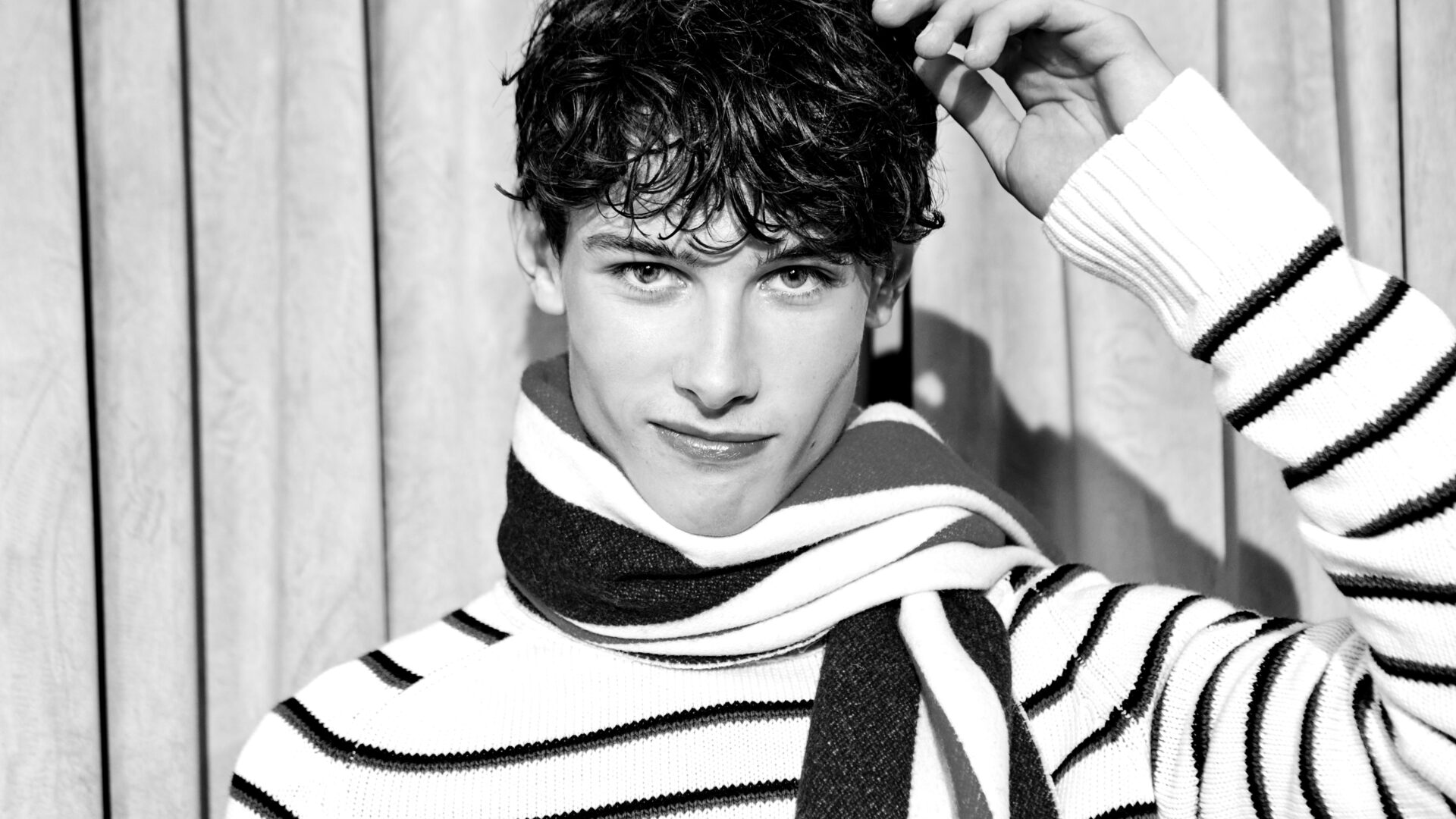 A model wears striped knitwear from the Mithridate Karaoke Club Capsule collection