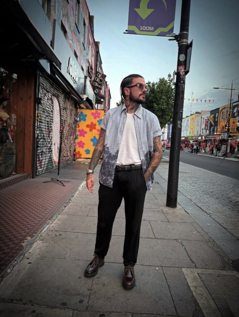 Demitri Lucifer Rodriguez posing in a street 