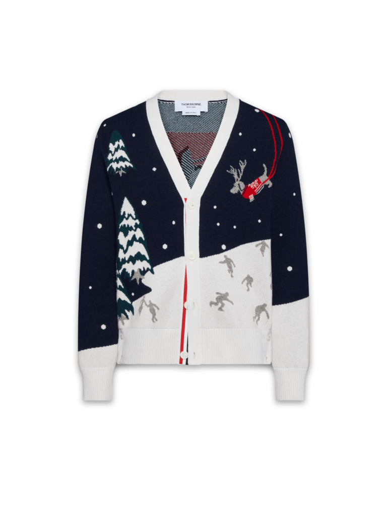 A product shot of Thom Browne cardigan featuring an intarsia scene of holidays featured in Attitude's 2025 luxury gift guide