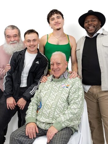 LGBT Foundation, Man Enough campaign with group of people huddled together