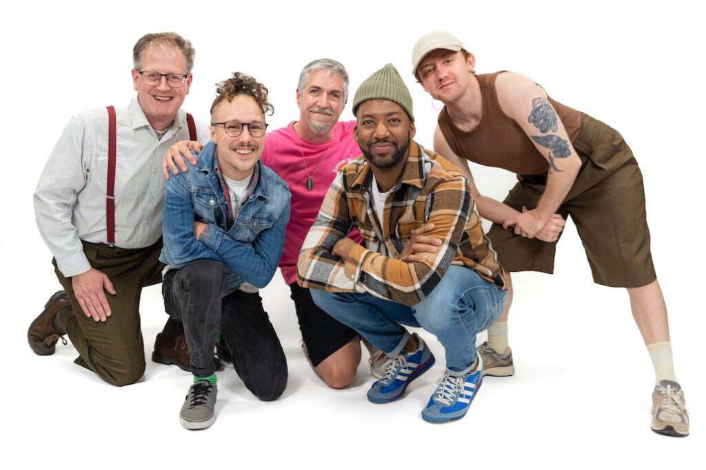 LGBT Foundation, Man Enough campaign with group of people smiling and laughing on the floor