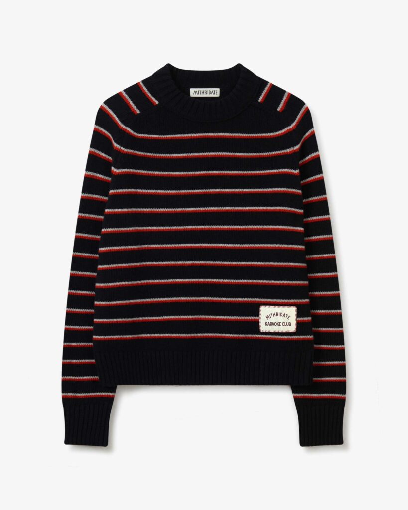 Product imagery of a black wool jumper with red micro stripes from the Mithridate Karaoke Club capsule collection.