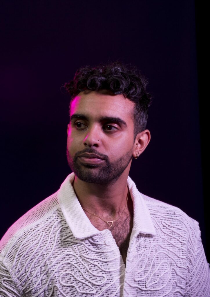 Sabah Choudrey lit by a pink light