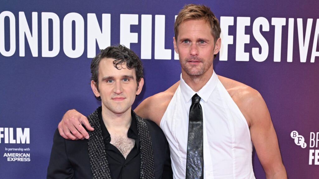 Harry Melling with Pillion co-star Alexander Skarsgård on the red carpet in black and white at London Film Festival