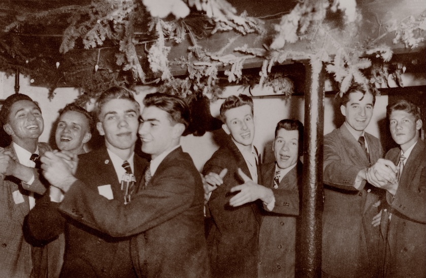 four male couples in suits dancing