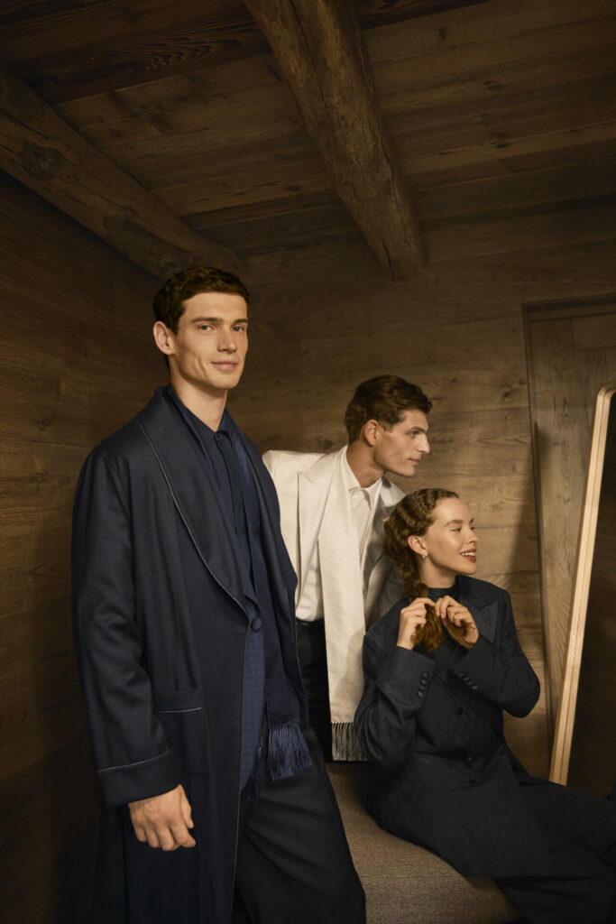 A lifestyle shot of models wearing the Canali Evening Capsule Collection