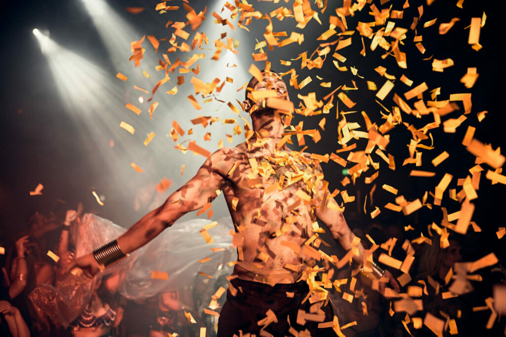 Sadiq Ali topless with confetti raining on him