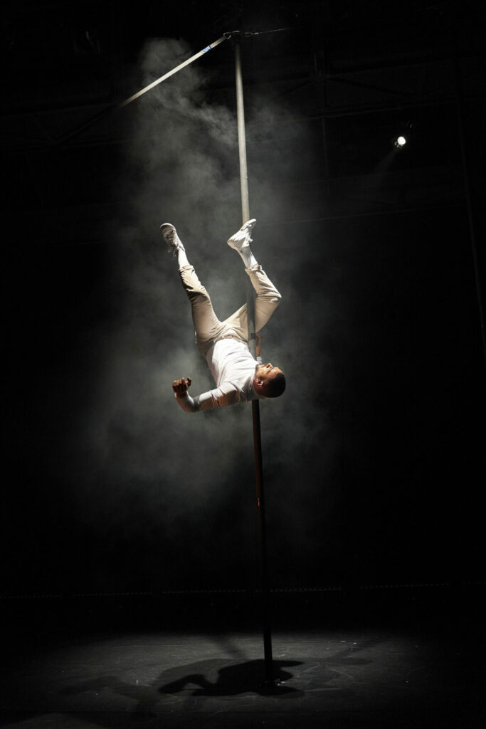 Sadiq Ali upside down on a pole 