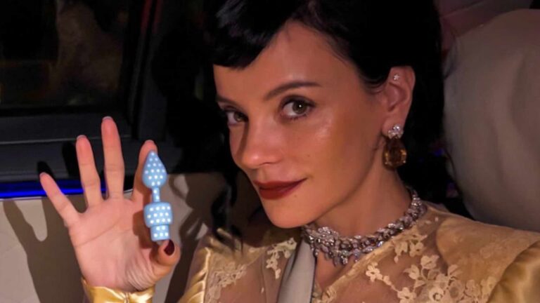 Lily Allen holding butt plug shaped USB