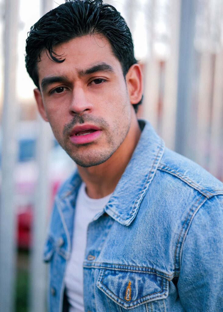 a portrait of the artist in a denim jacket 