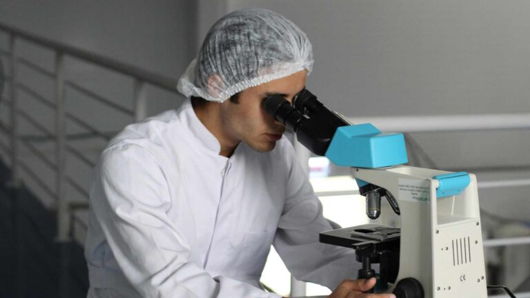 doctor looking through telescope