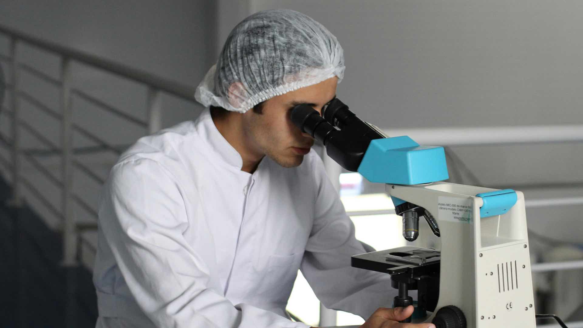 doctor looking through telescope