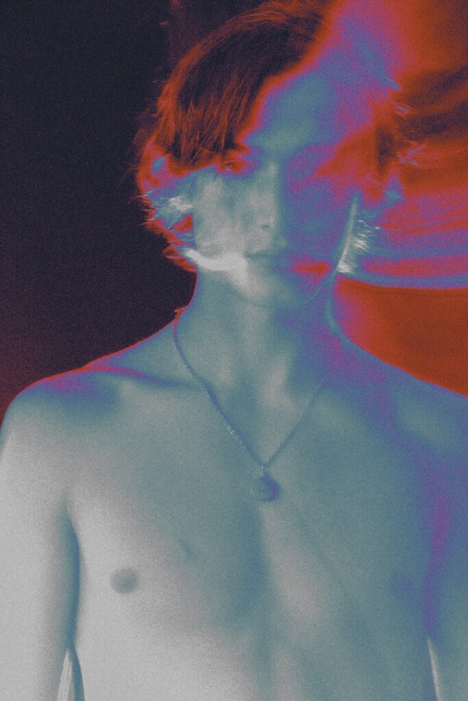 a model topless with long hair with the shot overexposed