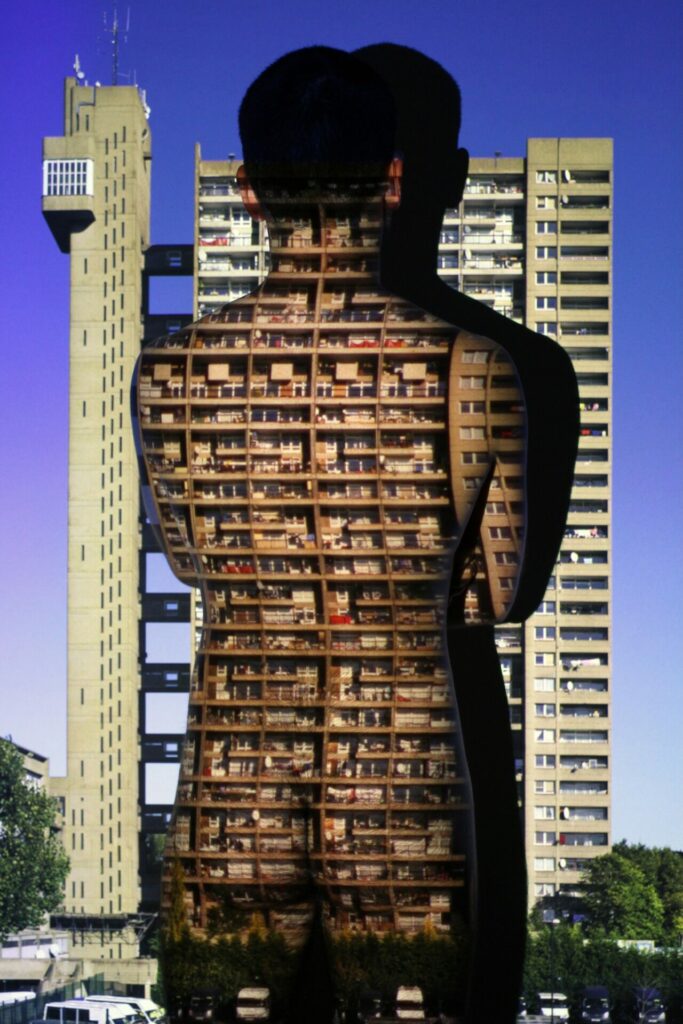 A photograph by Nigel Grimmer depicting the back of a nude body over the top of a tower block