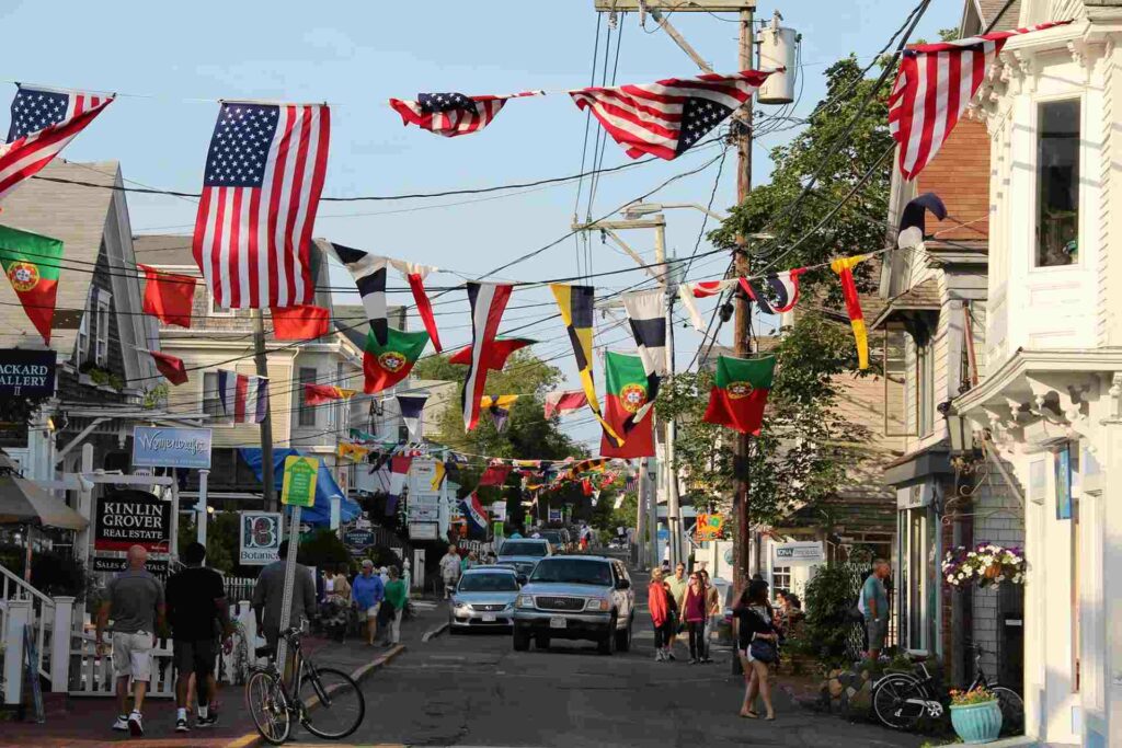 Ptown Commercial Street with flags flying across the street