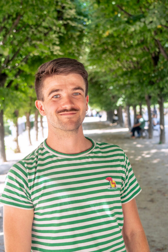 Alex Mesturoux wearing a green and white striped t-shirt 