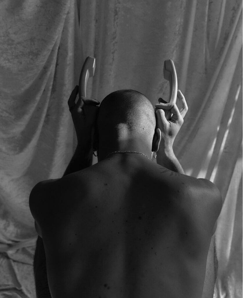 Jean Daniel Brousse shot rom behind topless sitting down as part of Public Matter Series shortlisted by Lens Culture BW Awards © Francisco Gomez de Villaboa