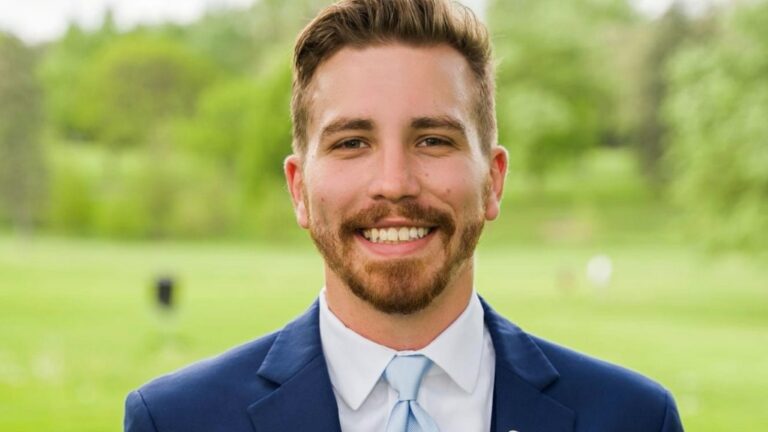 Portrait shot of a smiling man in a blue suit jacket