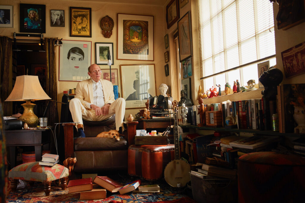 Gay historian and writer Robert Davidoff in a sitting room surrounded by books and paintings