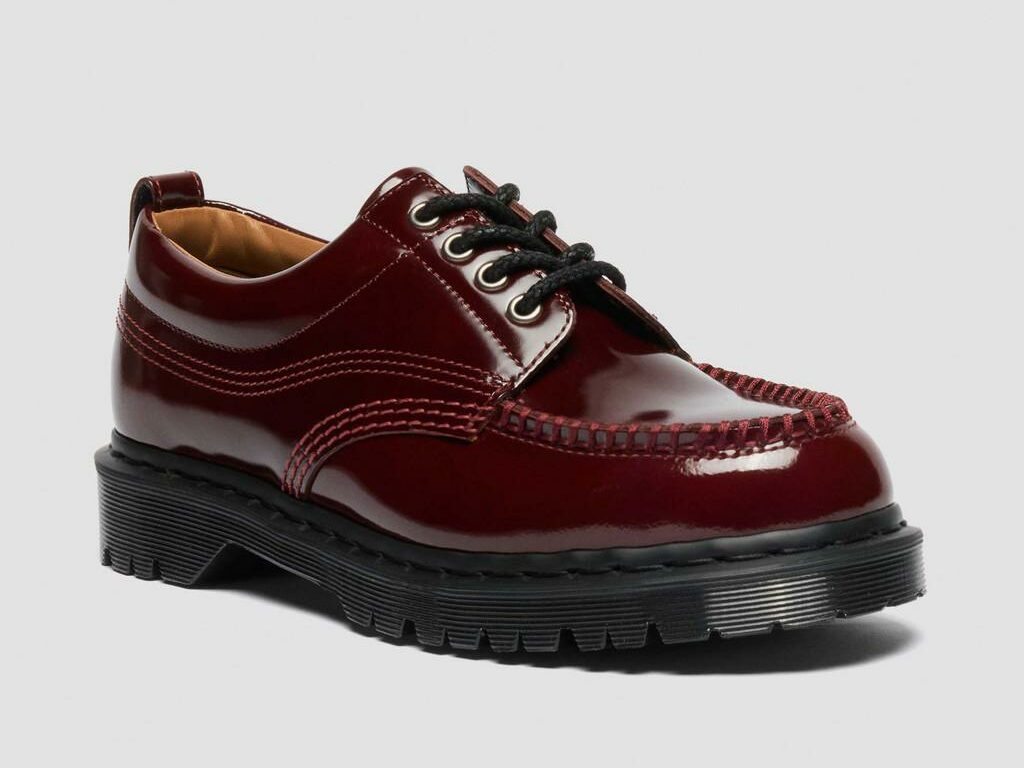A product shot of the Dr. Martens Lowell Lacquered Moc Toe in high-shine burgundy as part of Attitude's spring shoes shopping gallery