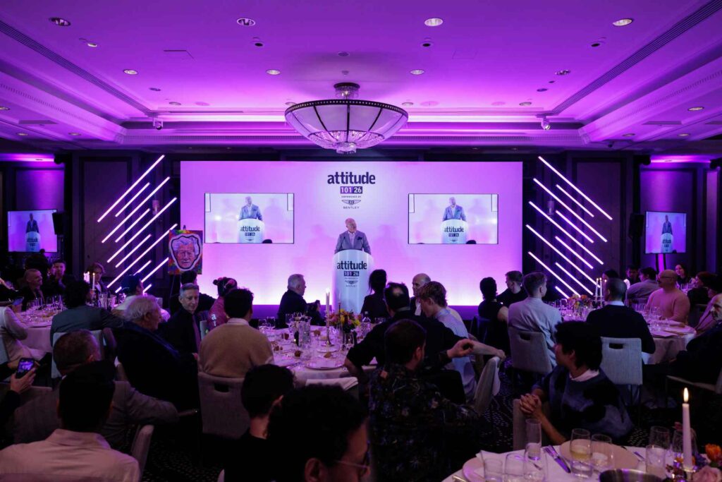 Darren Styles standing at a podium giving a speech at Attitude 101 2026