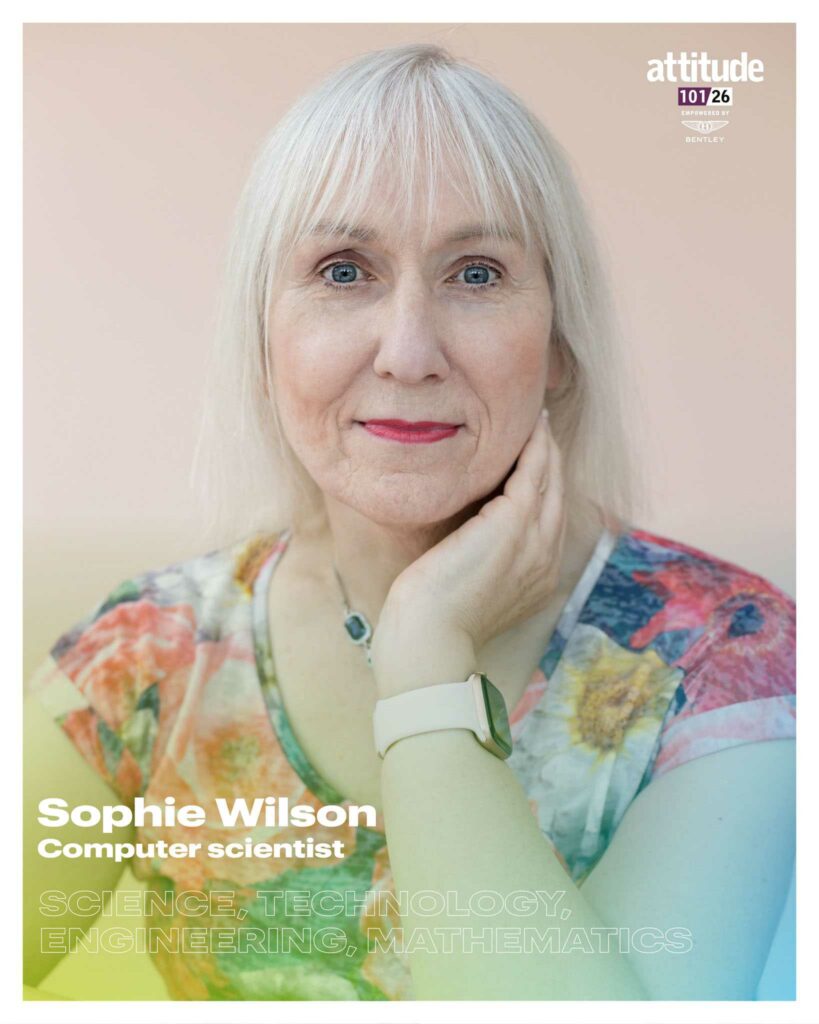 Sophie Wilson looking at the camera with her hand resting on her neck, wearing a patterned top and watch, against a soft-coloured background, with the Attitude 101 logo visible in the top corner.