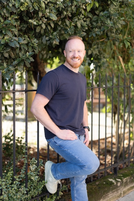 Daniel O&rsquo;Shaughnessy leaning up against a fence 