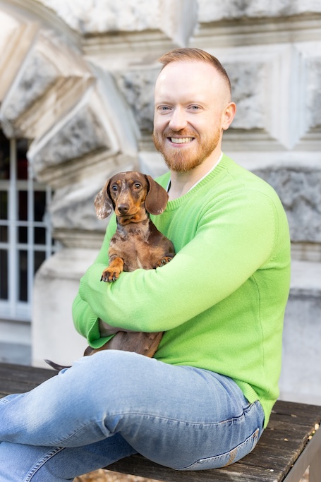 Daniel O&rsquo;Shaughnessy holding up his dog