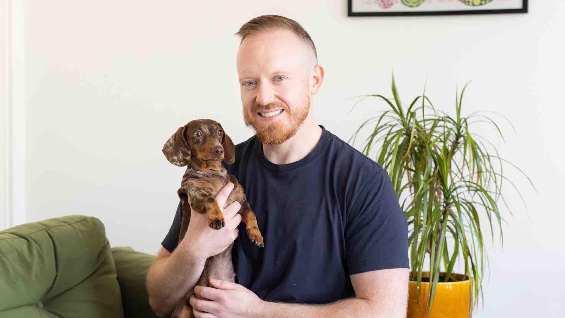 Daniel O’Shaughnessy holding up his dog