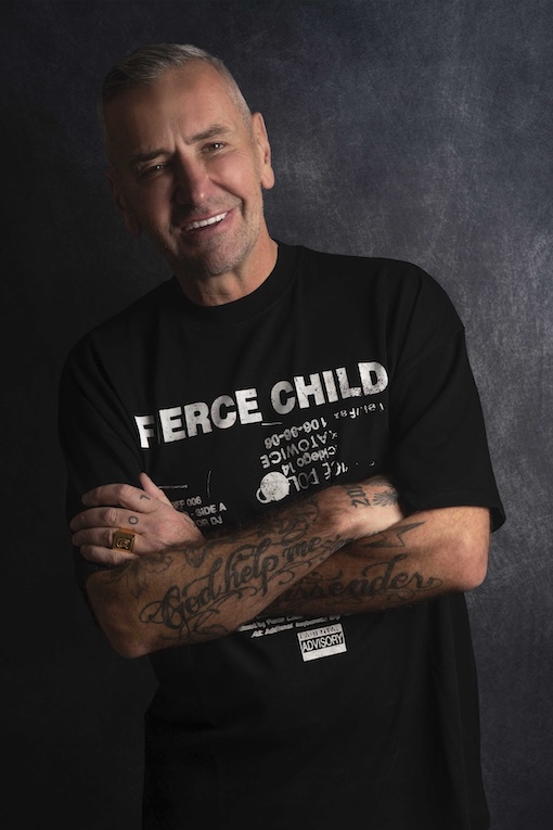 DJ Fat Tony wore a Fierce Child black T-shirt and crossed his arms