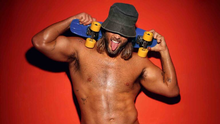 Mitch Brown shirtless flexing his muscles