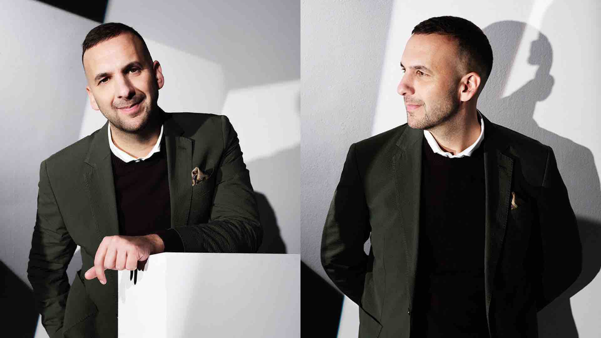 Zack Polanski wears a black jumper over a white shirt beneath a green blazer, leaning over a white podium; on the right, he is pictured looking to the left