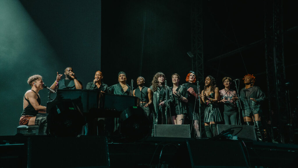 Olly Alexander performing with Trans Voices at Mighty Hoopla
