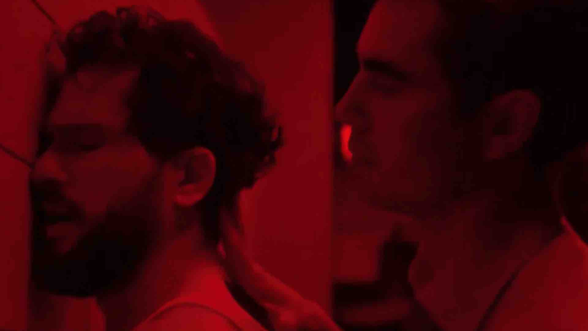 Kit Harington at a glory hole in Industry, under red lighting, with Max Minghella’s character pulling his hair