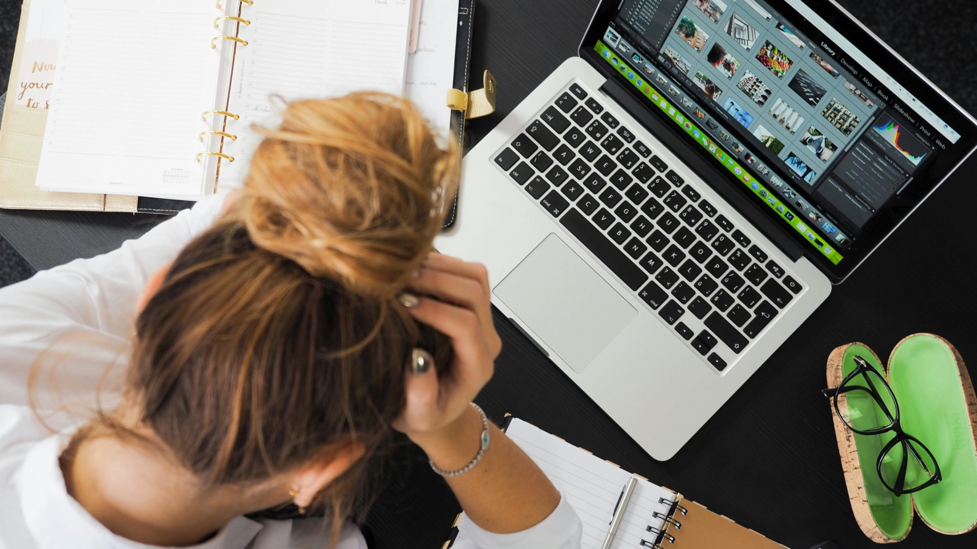 Woman sitting in front of a laptop