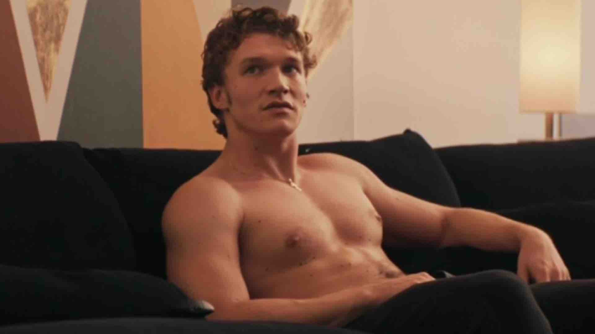 Connor Storrie shirtless in Heated Rivalry still